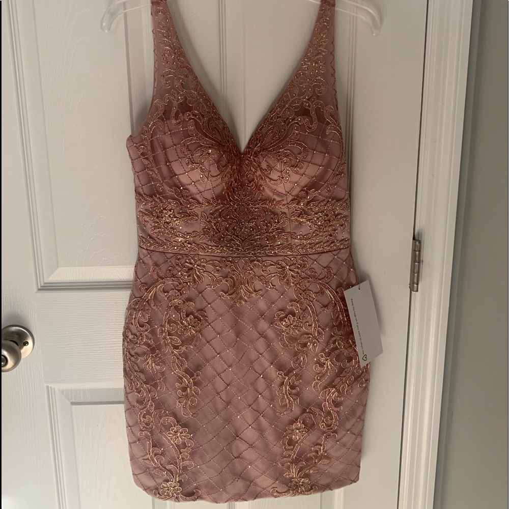 Size M and the length is 34” Embroidered mesh & rhinestone w/ included bra cups